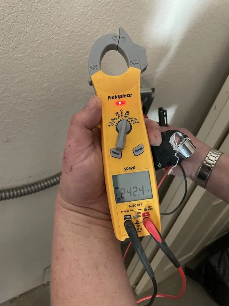 Voltage testing with clamp meter during Circuit Breaker Repair in Grand Bay